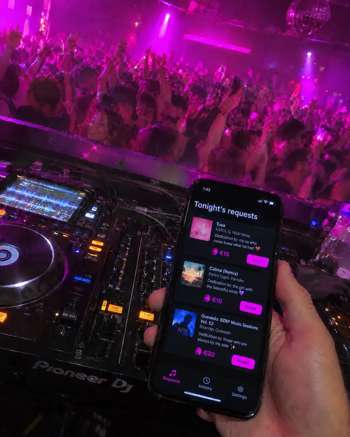 From inside the booth, the DJ checks tonight's requests on his phone, each with its dedication and tip, with a packed dance floor in front.